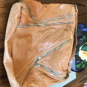 This is a truly amazing beautiful bag. The leather is pebbled and embossed.